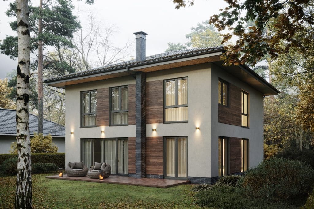 A modernized home exterior with accent panels and lighting 