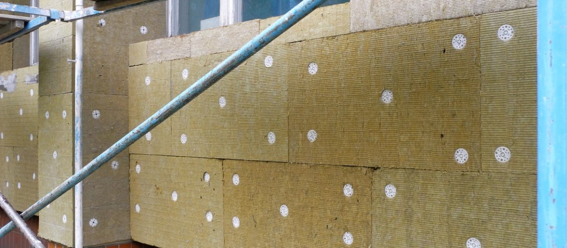 Insulating of facade with mineral wool mats